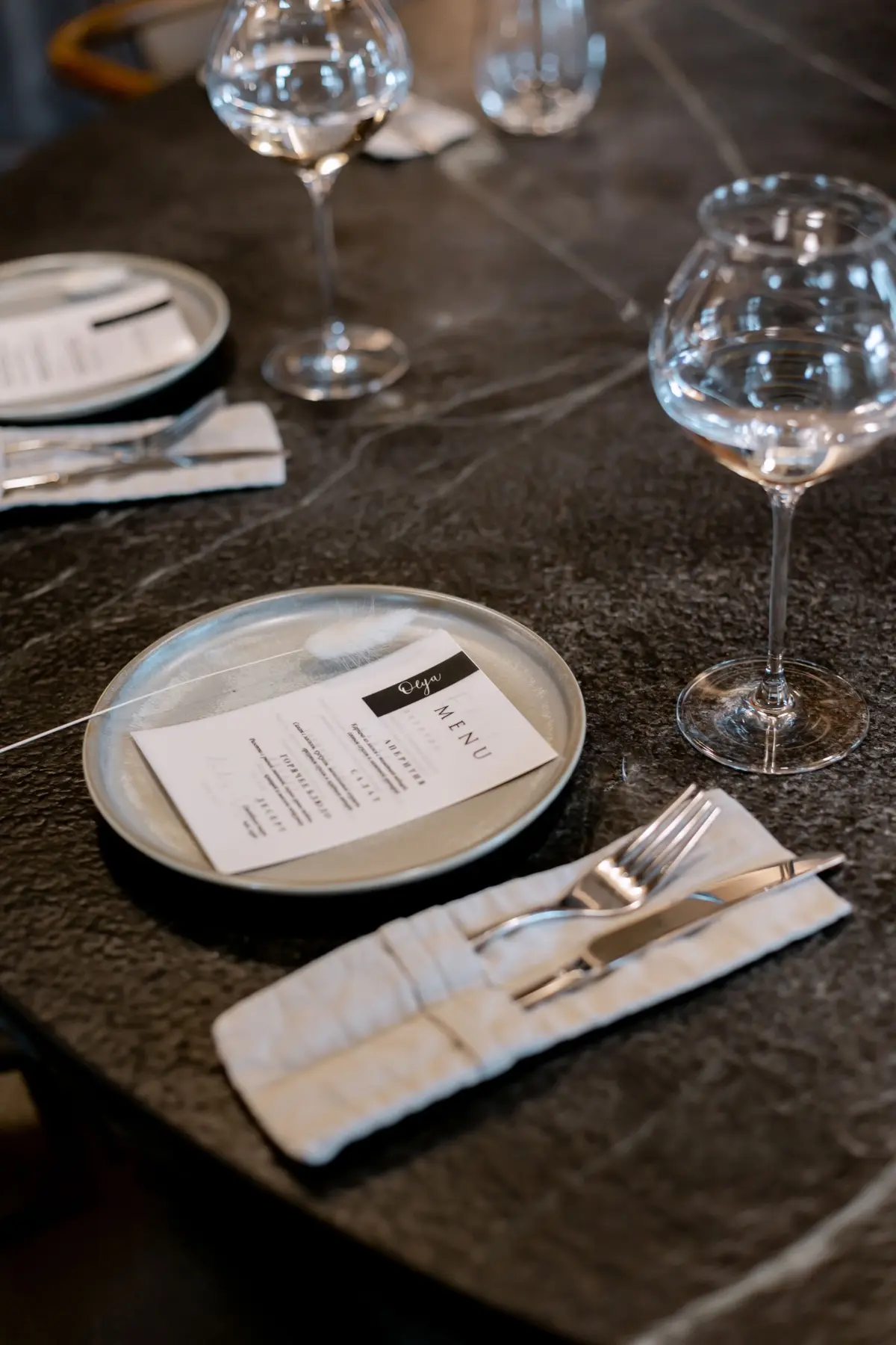 Printed restaurant menu arranged at a place setting